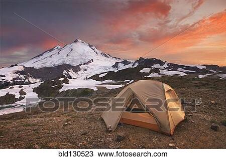 Tent at campsite in snowy mountain landscape View Large Photo Image Stock Image - Tent at campsite in snowy mountain landscape. Fotosearch