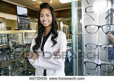 Vietnamese optometrist smiling in office View Large Photo Image Stock Photography - Vietnamese optometrist smiling in office. Fotosearch