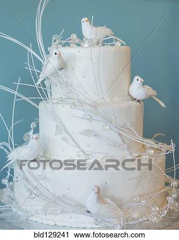 Stock Image - Wedding cake decorated with birds. Fotosearch