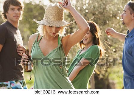 Stock Image - Woman dancing outdoors. Fotosearch