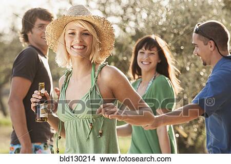 Woman drinking beer outdoors View Large Photo Image Picture - Woman drinking beer outdoors. Fotosearch