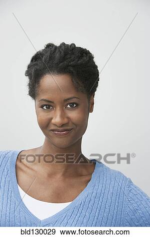Stock Photo - Woman smiling outdoors. Fotosearch