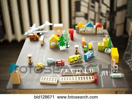 Wooden buildings and car toys on table View Large Photo Image Stock Image - Wooden buildings and car toys on table. Fotosearch