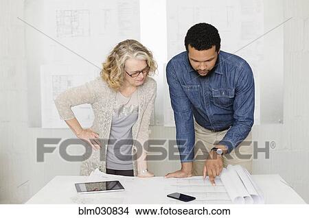 Architects working together in office View Large Photo Image Picture - Architects working together in office. Fotosearch
