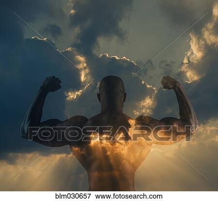 Stock Photo - Black man flexing muscles in clouds. Fotosearch
