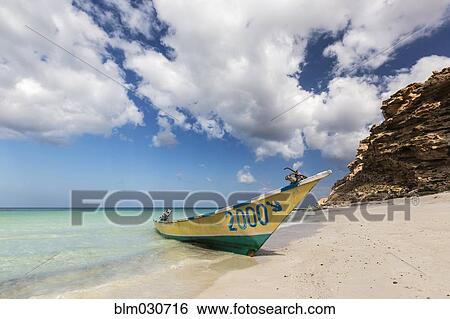 Stock Photograph - Boat on tropical beach. Fotosearch