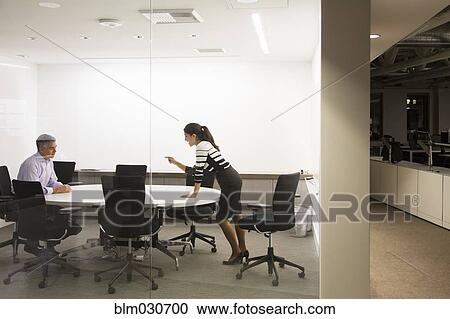 Business people having meeting in office View Large Photo Image Stock Image - Business people having meeting in office. Fotosearch