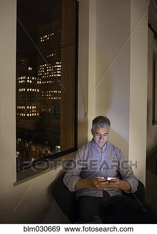 Caucasian businessman working late in office View Large Photo Image Stock Photo - Caucasian businessman working late in office. Fotosearch