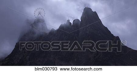 Ferris wheel on rocky mountaintop View Large Photo Image Stock Image - Ferris wheel on rocky mountaintop. Fotosearch