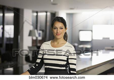 Mixed race businesswoman working late in office View Large Photo Image Picture - Mixed race businesswoman working late in office. Fotosearch