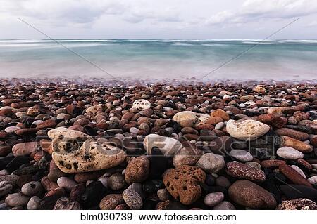 Pebbles covering beach View Large Photo Image Stock Photo - Pebbles covering beach. Fotosearch
