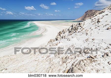 Stock Photo - Sand dunes on rocky coastline. Fotosearch