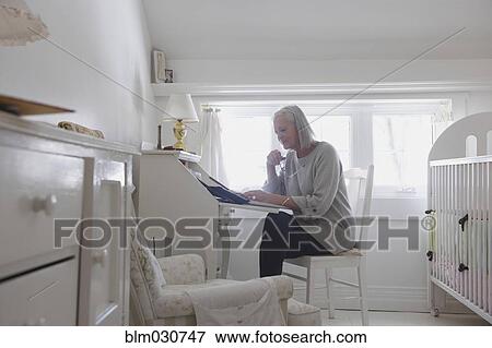 Stock Photo - Senior Caucasian woman using laptop. Fotosearch