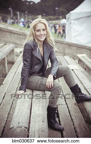 Stock Photo - Woman smiling at festival. Fotosearch
