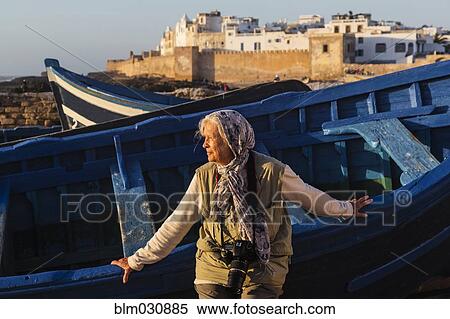 Caucasian woman leaning on boat outdoors View Large Photo Image Stock Photography - Caucasian woman leaning on boat outdoors. Fotosearch