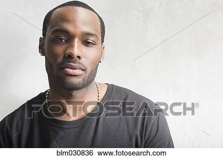 Stock Photograph - Close up of African American man's face. Fotosearch