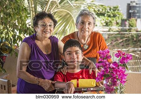 Stock Photo - Hispanic family smiling together. Fotosearch