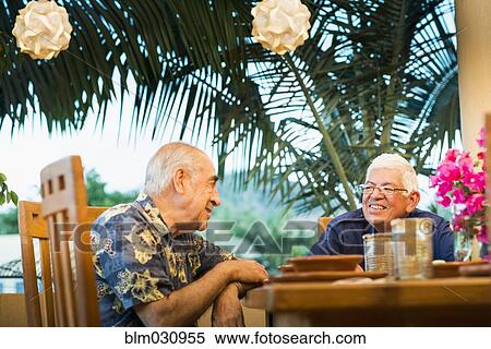 Hispanic men eating together in restaurant View Large Photo Image Stock Photography - Hispanic men eating together in restaurant. Fotosearch