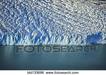 Aerial view of glacier's edge and water View Large Photo Image Stock Photograph - Aerial view of glacier's edge and water. Fotosearch