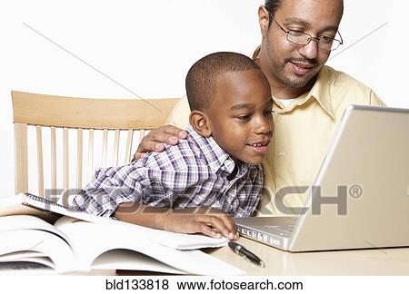 African American father helping son with homework View Large Photo Image Stock Photo - African American father helping son with homework. Fotosearch