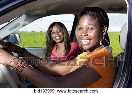 Stock Photo - African American women driving together. Fotosearch