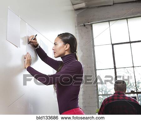 Stock Photograph - Architects working in office. Fotosearch