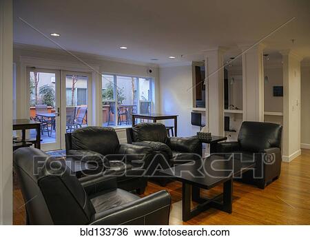 Armchairs and coffee tables in common area View Large Photo Image Stock Photograph - Armchairs and coffee tables in common area. Fotosearch