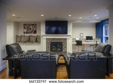 Stock Image - Armchairs and television in common area. Fotosearch