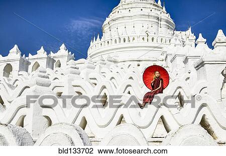 Asian woman sitting on temple walls, Mingun, Saigang, Myanmar View Large Photo Image Stock Image - Asian woman sitting on temple walls, Mingun, Saigang, Myanmar. Fotosearch