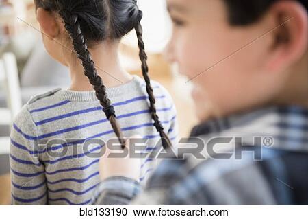 Boy pulling girl's pigtails View Large Photo Image Stock Image - Boy pulling girl's pigtails. Fotosearch