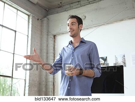 Caucasian architect drinking coffee in office View Large Photo Image Stock Photo - Caucasian architect drinking coffee in office. Fotosearch