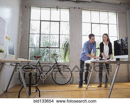 Picture - Caucasian architects working in office. Fotosearch