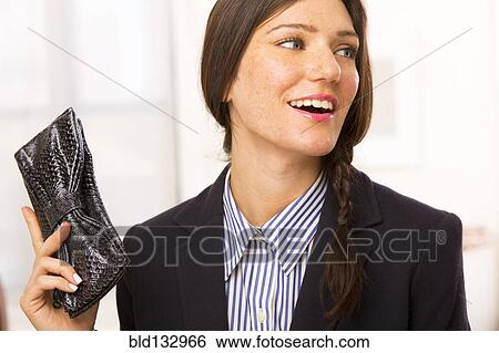 Caucasian businesswoman holding purse View Large Photo Image Stock Photograph - Caucasian businesswoman holding purse. Fotosearch
