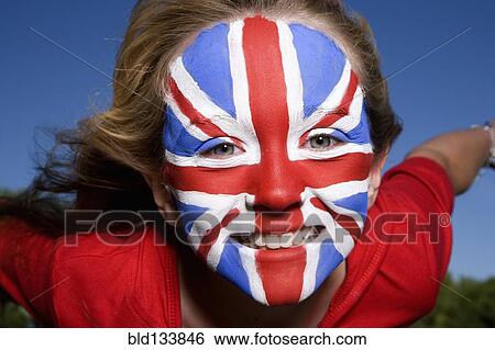 Stock Photograph - Caucasian girl with United Kingdom flag painted on face. Fotosearch