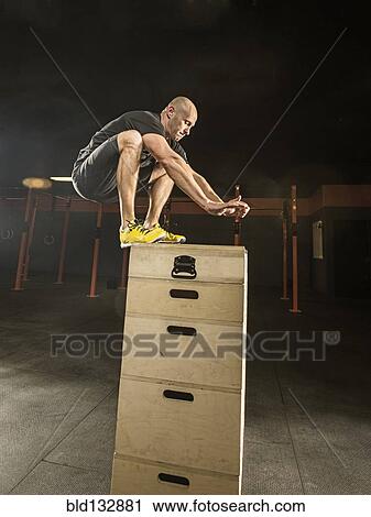 Caucasian man exercising in gym View Large Photo Image Stock Image - Caucasian man exercising in gym. Fotosearch