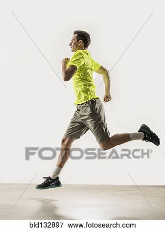 Caucasian man jogging indoors View Large Photo Image Stock Photo - Caucasian man jogging indoors. Fotosearch