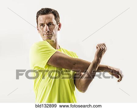 Caucasian man stretching View Large Photo Image Stock Photo - Caucasian man stretching. Fotosearch