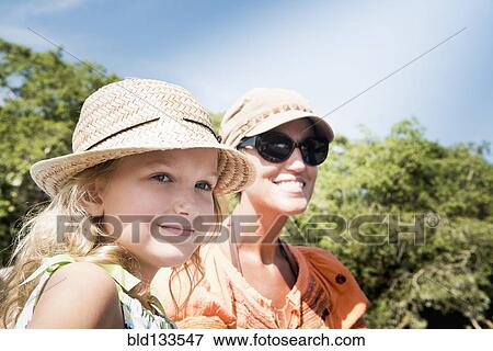 Caucasian mother and daughter smiling outdoors View Large Photo Image Stock Photo - Caucasian mother and daughter smiling outdoors. Fotosearch