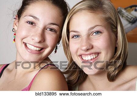 Caucasian teenage girls smiling together View Large Photo Image Stock Photography - Caucasian teenage girls smiling together. Fotosearch