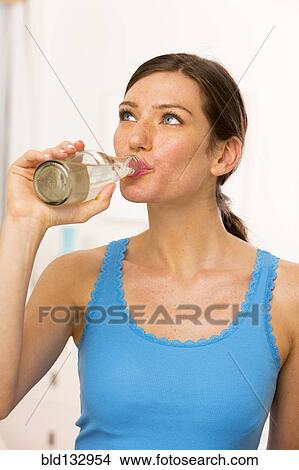 Caucasian woman drinking water View Large Photo Image Picture - Caucasian woman drinking water. Fotosearch