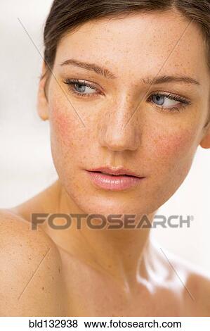 Stock Photo - Caucasian woman looking over her shoulder. Fotosearch