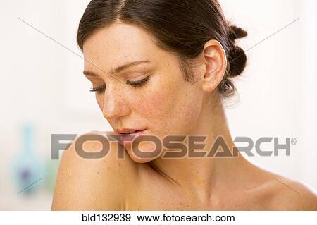 Stock Photo - Caucasian woman looking over her shoulder. Fotosearch