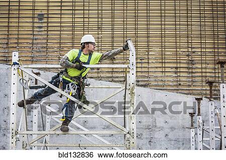Caucasian worker on scaffolding View Large Photo Image Stock Photograph - Caucasian worker on scaffolding. Fotosearch