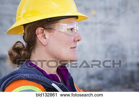 Caucasian worker wearing safety goggles on site View Large Photo Image Stock Image - Caucasian worker wearing safety goggles on site. Fotosearch