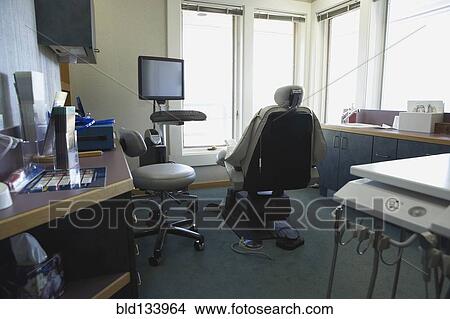 Chair and counters in empty dentist's office View Large Photo Image Picture - Chair and counters in empty dentist's office. Fotosearch