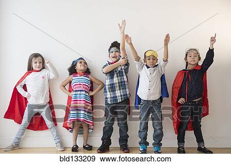 Stock Photo - Children in capes. Fotosearch