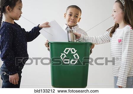 Stock Image - Children recycling together. Fotosearch