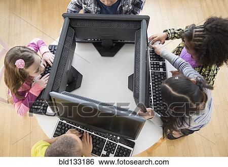 Children using computers in classroom View Large Photo Image Stock Photograph - Children using computers in classroom. Fotosearch