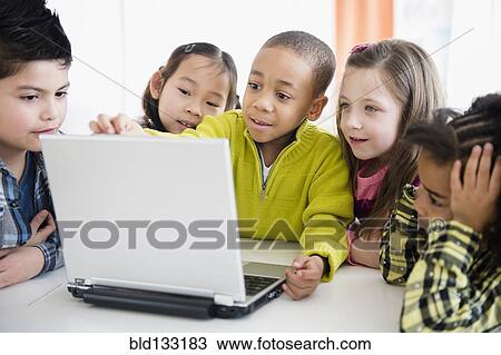 Children using laptop together View Large Photo Image Stock Image - Children using laptop together. Fotosearch