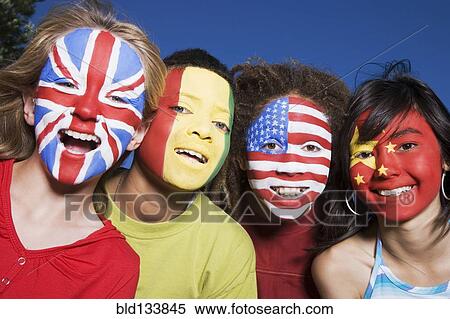 Stock Photography - Children with United Kingdom, Guinean, United States and Chinese flags painted on faces. Fotosearch